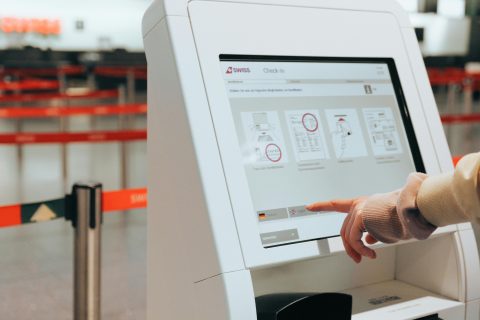passengers checking flight status airport 1